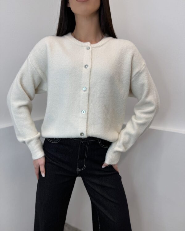 Beige susagstomas megztinis